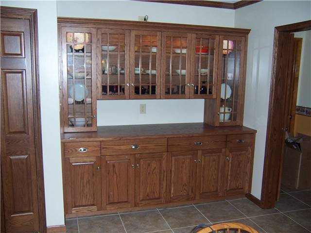 Red oak cabinets - Arts and crafts glass doors - Raised panel lower doors - Full overlay style - Wood countertop
